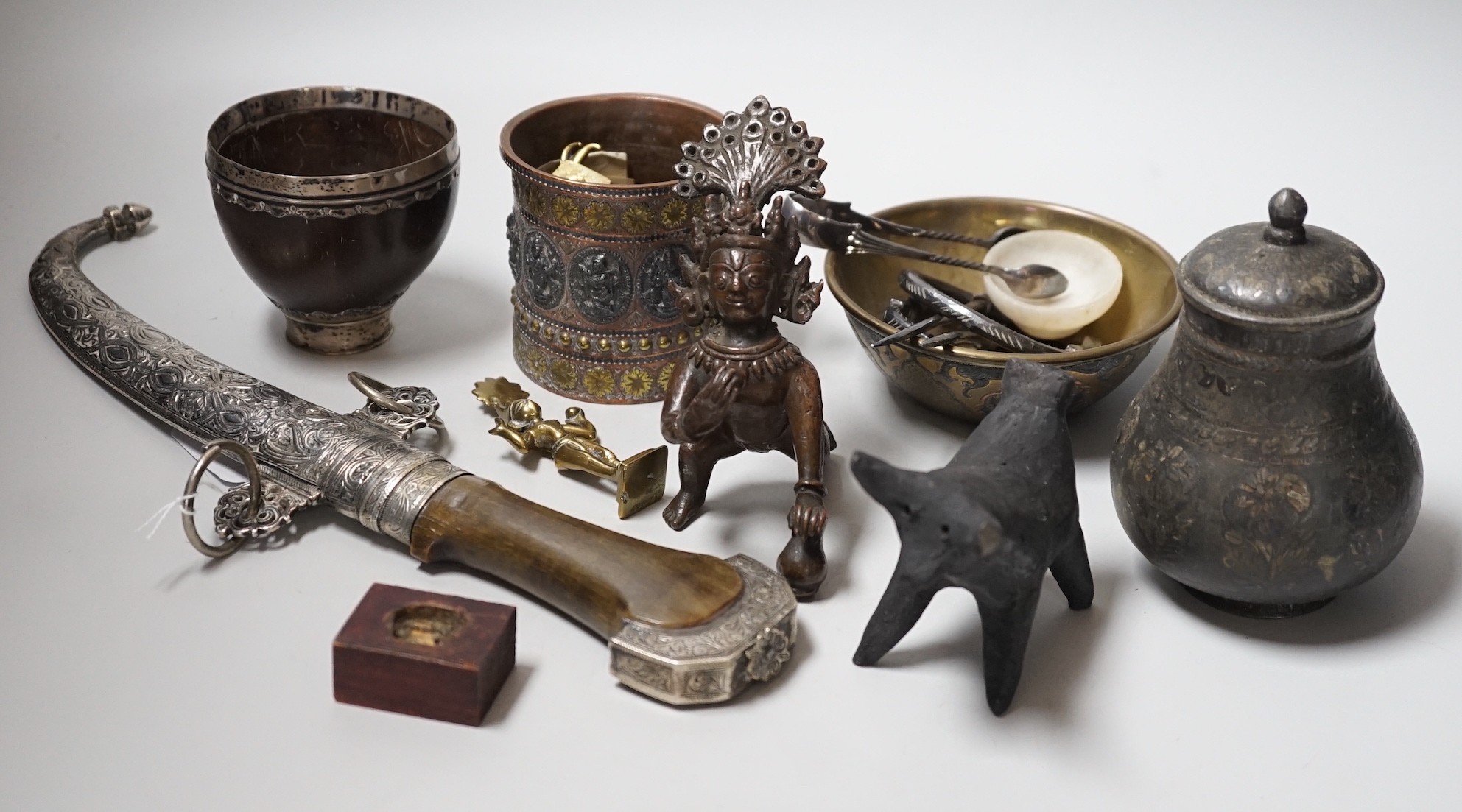 An Eastern white metal mounted dagger, a quantity of Eastern metalware and a white metal-mounted cup